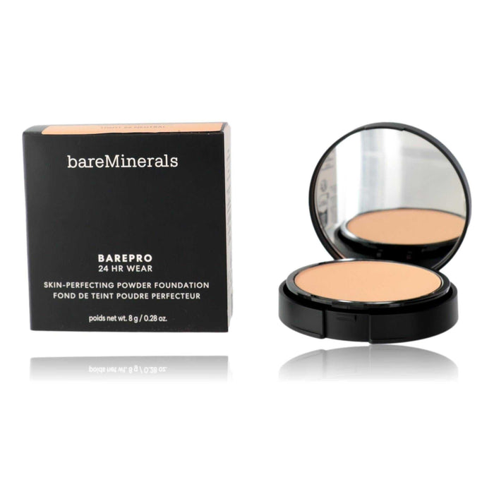Bare Minerals BarePro powder foundation in a black compact with mirror and light beige pressed powder, shown beside its box