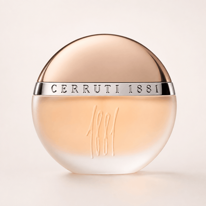 Cerruti 1881 EDT Women perfume in a round translucent peach-toned bottle with a silver band and embossed design