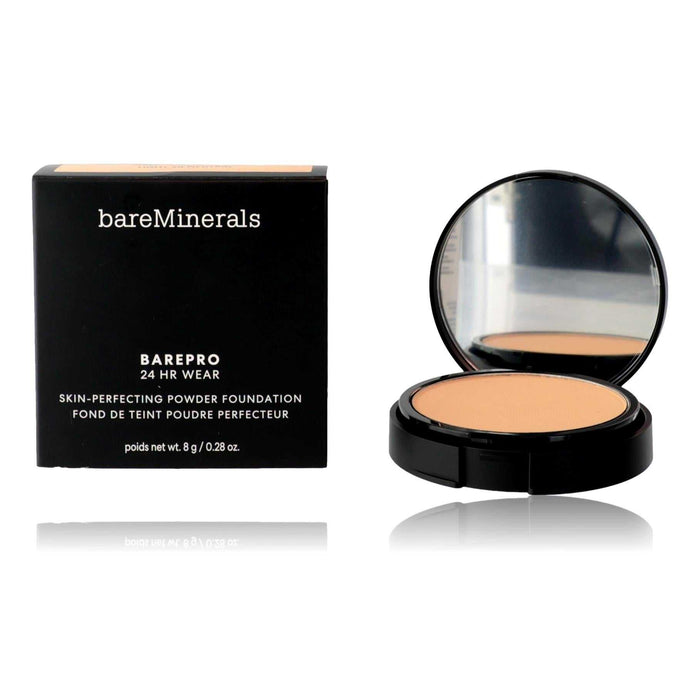 Bare Minerals BarePro powder foundation in a black compact with mirror and warm light beige pressed powder beside its black box