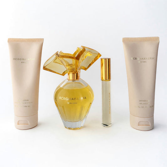 Bon Chic BY BCBG MAXAZRIA four-piece fragrance gift set with golden perfume bottles and pale lotion and shower gel tubes