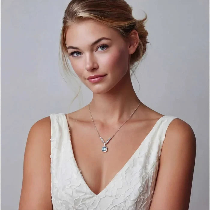 Celestial Arc Moissanite Necklace in polished silver, with a delicate V-shaped stone chain and blue square pendant halo