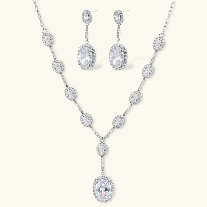 Celestial Cascade CZ Necklace set in silver-tone metal with oval cubic zirconia accents, a Y-shaped pendant and matching drop earrings