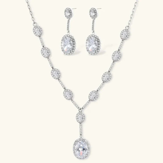 Celestial Cascade CZ Necklace set in silver-tone metal with oval cubic zirconia accents, a Y-shaped pendant and matching drop earrings