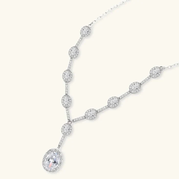 Celestial Cascade CZ Necklace in silver-tone metal with sparkling round stones and an oval-cut drop pendant in a Y shape