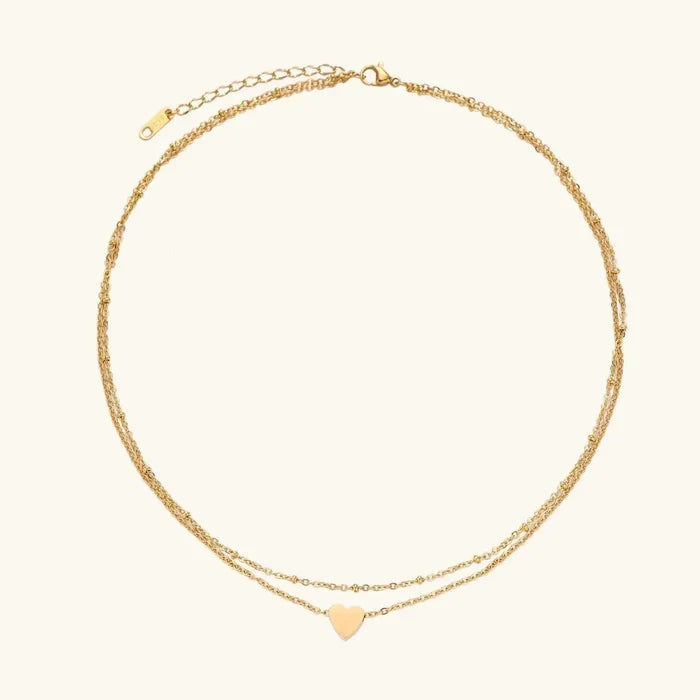 Layered Heart Necklace in gold-tone metal with two fine chain layers and a small polished heart pendant