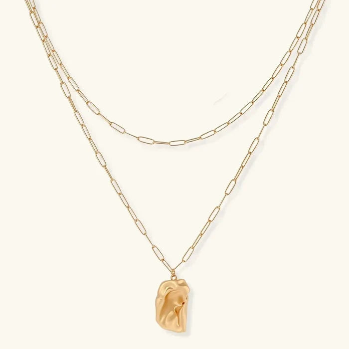 Molten Dreams Layered Paperclip Pendant Necklace in gold tone, with two staggered chains and a sculpted irregular rectangular pendant