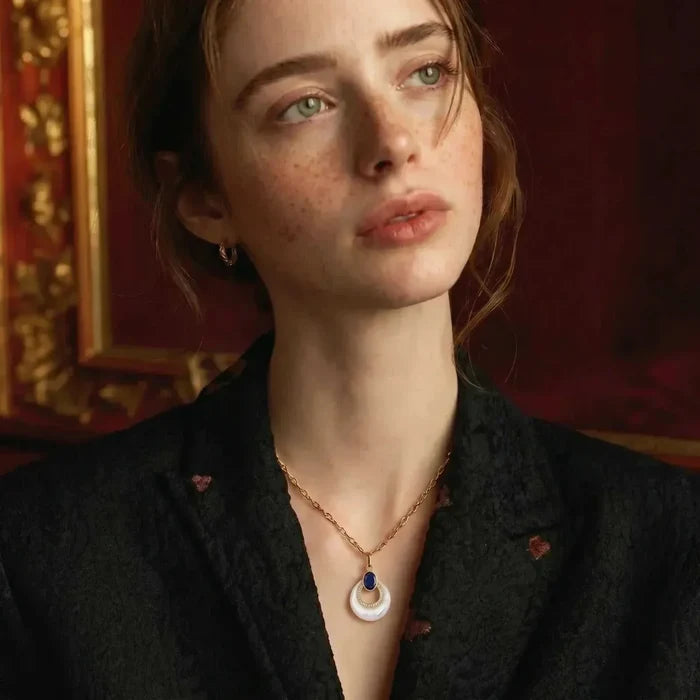 Mystic Mother-of-Pearl & Lapis Lazuli Necklace with a white round pendant, blue oval stone and gold-tone chain