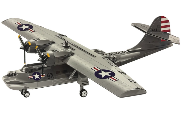 A toy building-block style model of a vintage military aircraft with twin propellers, shown on a plain white background. The plane is primarily gray with U.