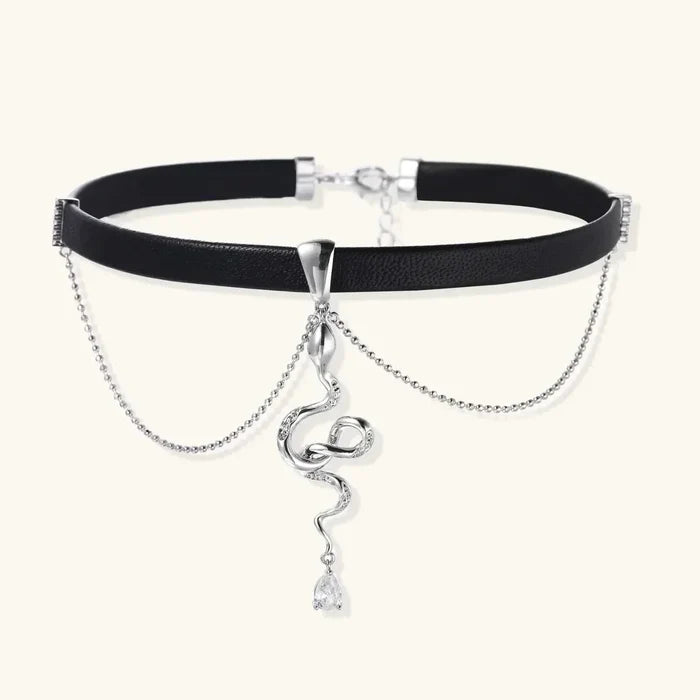 Serpent Power Black Suede choker with a black cord, silver-tone serpent pendant, pear-shaped clear drop and draped chains